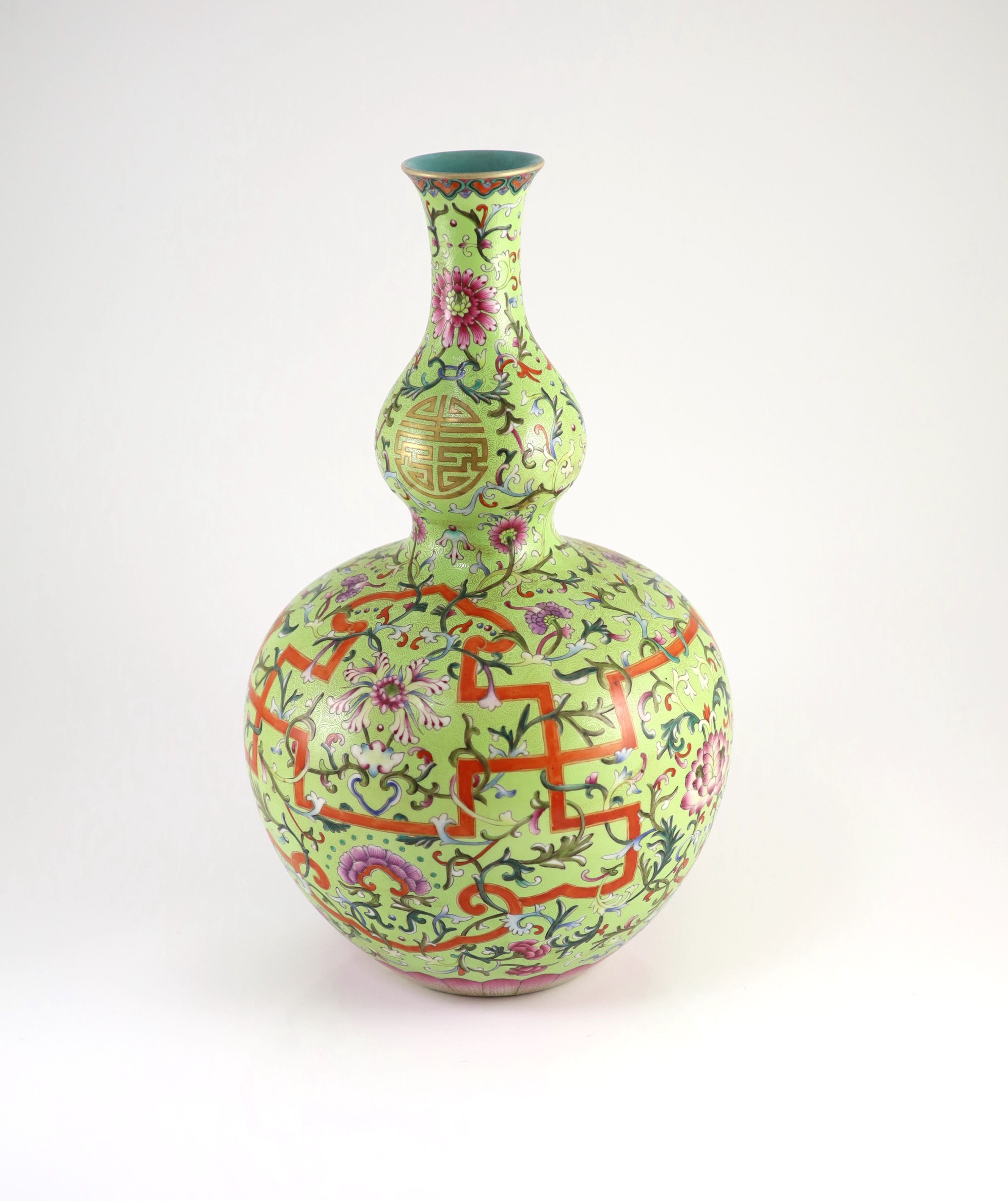 A Chinese lime green sgraffito ground double gourd vase, Qianlong mark but later, 40cm high